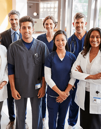 Close-up photo of a doctor in a white coat with a stethoscope